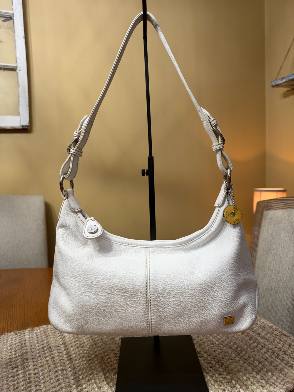 The Sak White Pebbled Leather Shoulder Bag with Gold Accents